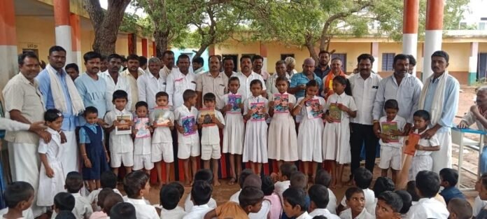 Distribution of notebooks and pens to government school children